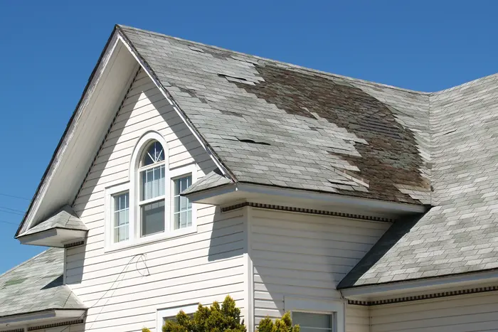 Roof damage repair on an asphalt shingle home after storm exposure in Bergen County, New Jersey