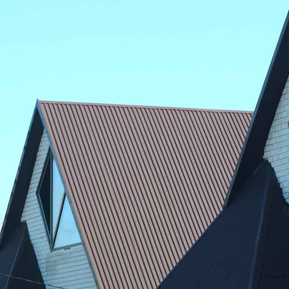 Modern metal roof and siding installation on residential house in Monmouth County, New Jersey.