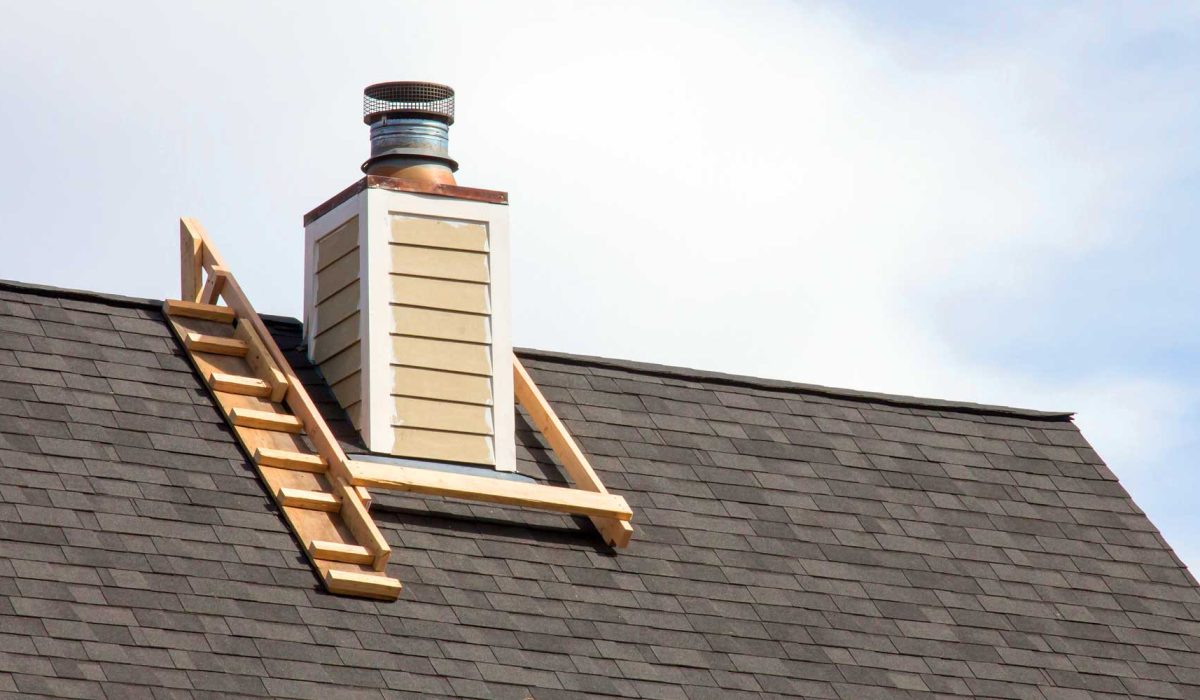 Close-up view of chimney flashing installed to prevent roof leaks.