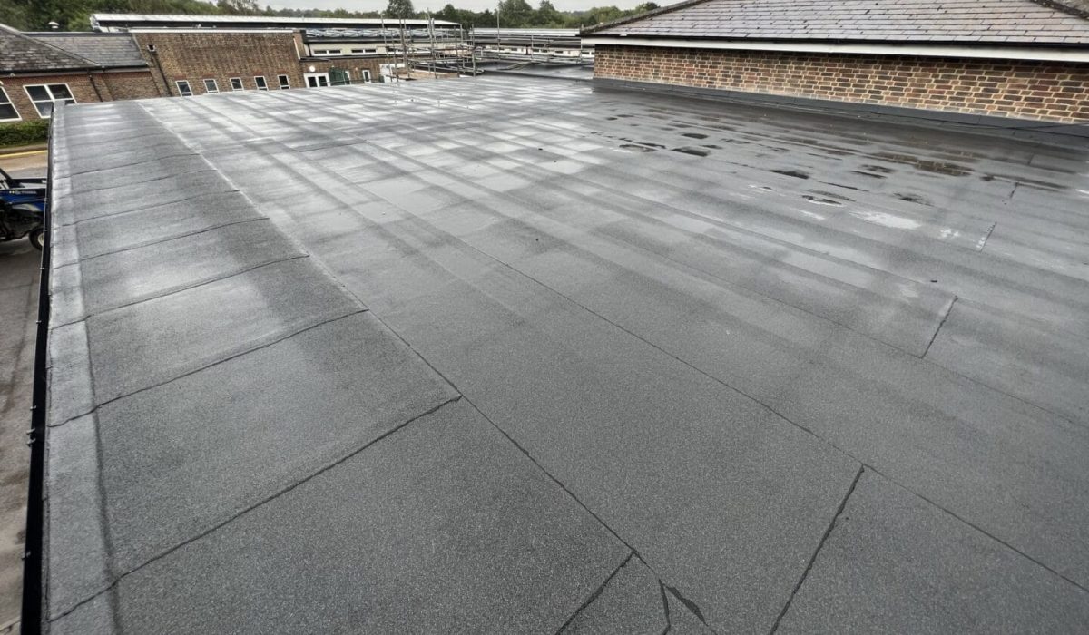 Commercial flat roof with membrane installation.