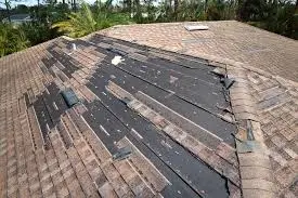 Severe storm roof damage with missing shingles on a residential home in Newark, New Jersey