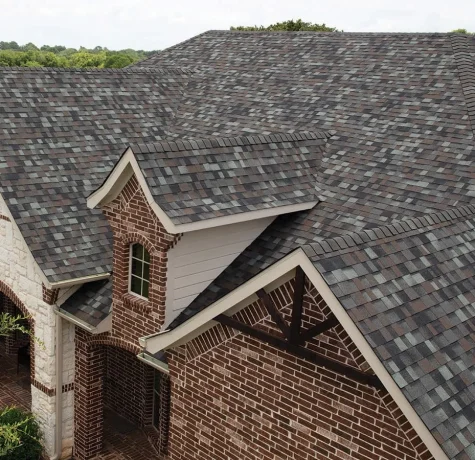 Roofing estimate and cost breakdown on clipboard.