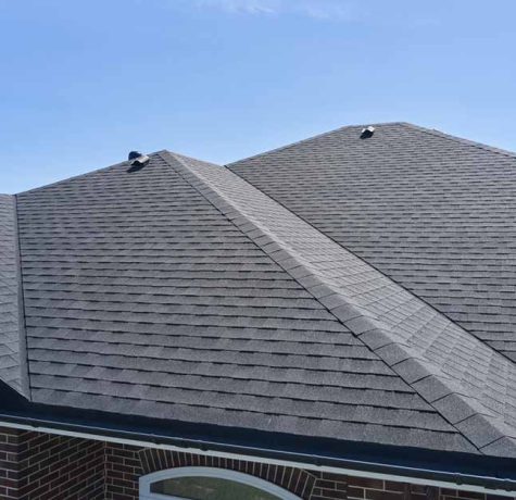 Homeowner reviewing roof warranty documents.