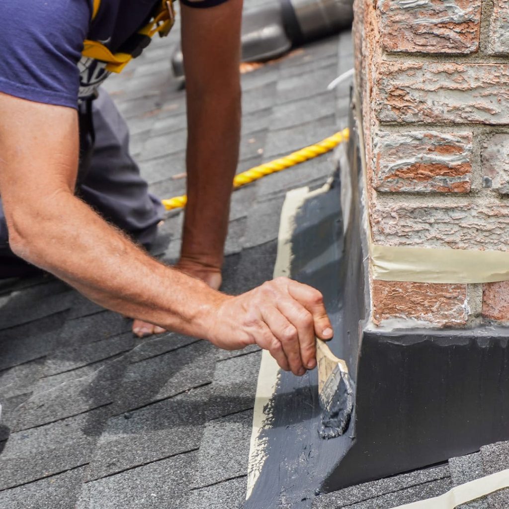 Roof flashing repair around chimney to prevent leaks in New Jersey homes