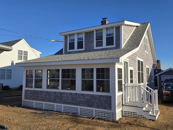 Roof installation in progress using GAF Timberline shingles for a residential house.