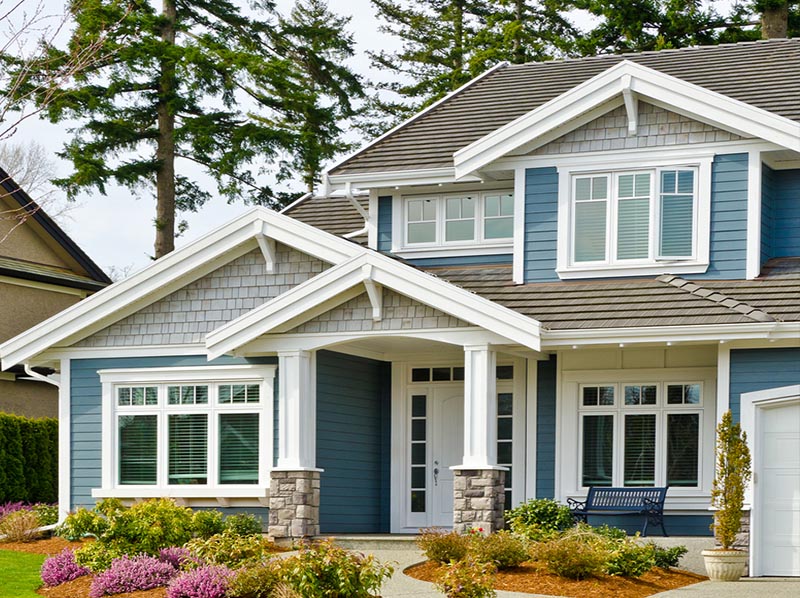 Modern home with blue polymer siding installation in New Jersey